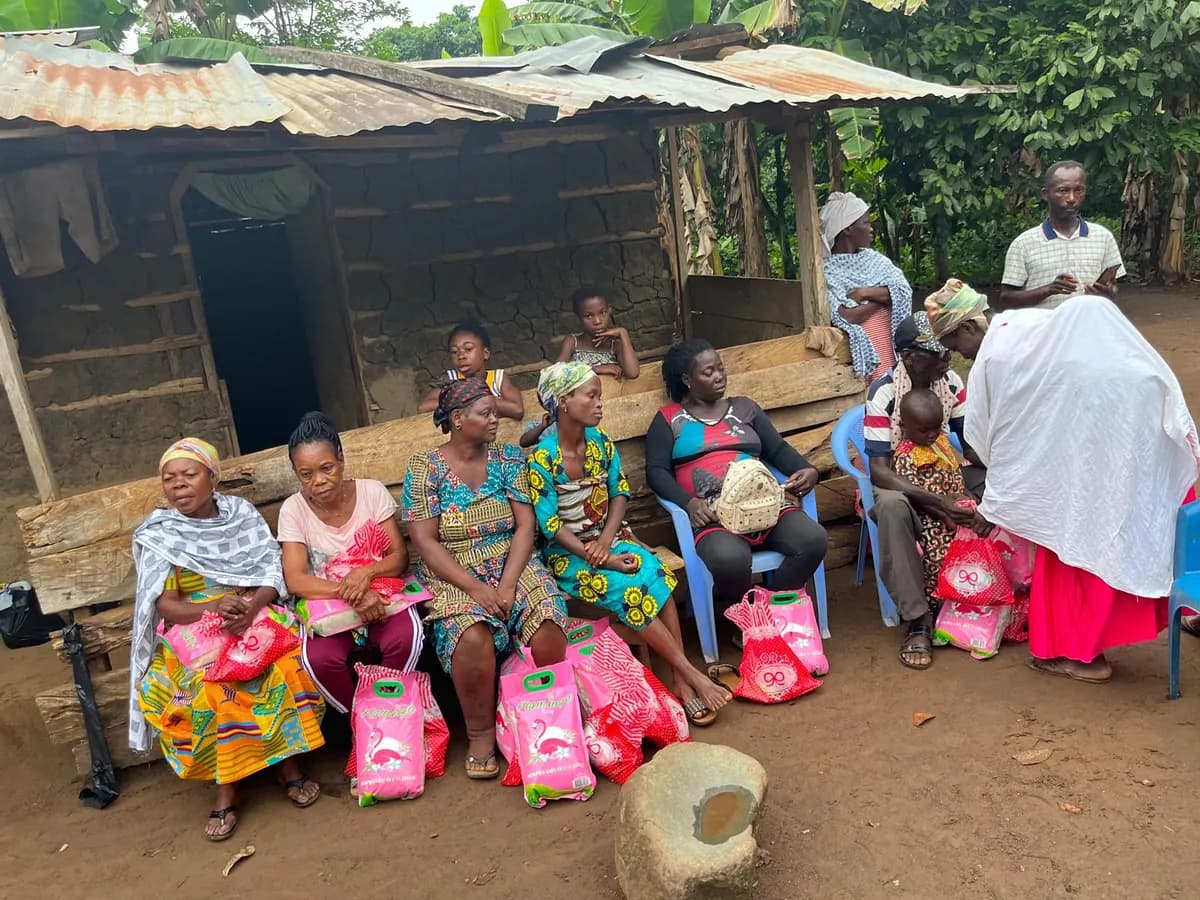 Community members seated with provisions received during an Eleos Foundation Global outreach in Ghana