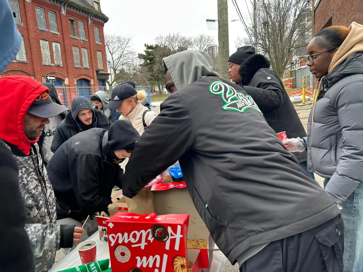 Distributing food and snacks at a community outreach in Toronto