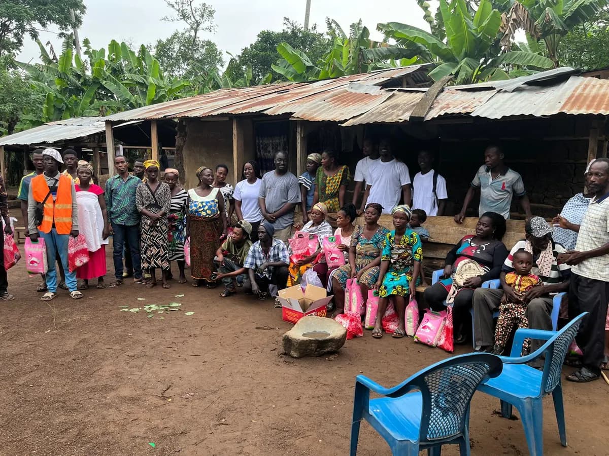 Community gathering during a donation visit in rural Ghana