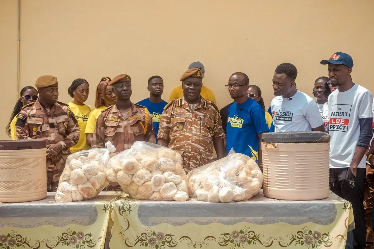 Presenting bread donations alongside prison service officials at Winneba