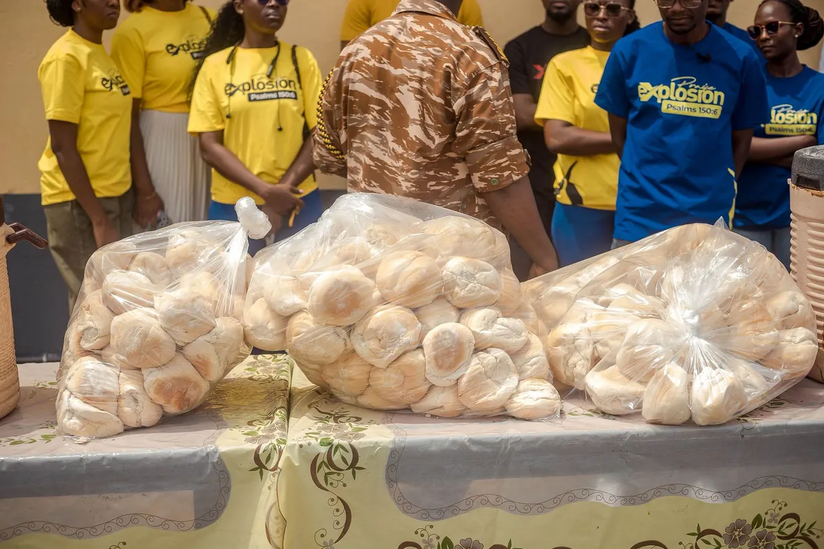 Praise Explosion volunteers preparing bread donations for the prison outreach
