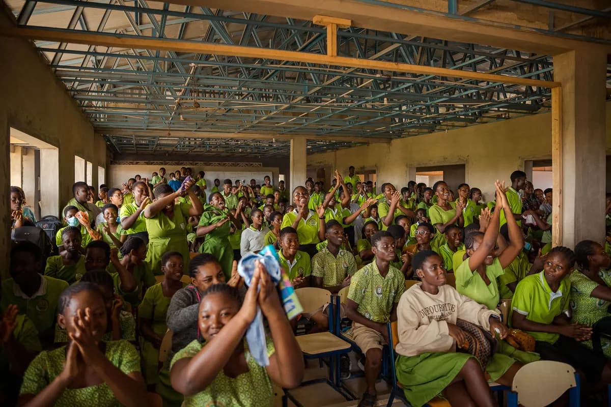 Students cheering and worshipping during the school outreach